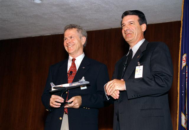 Author of Rocket Boys Homer Hickam, Jr. (left) and Marshall Space Flight Center Director Art Stephenson during a conference at Morris Auditorium. Homer Hickam worked at MSFC during the Apollo project years. As a young man, Mr. Hickam always dreamed of becoming a rocket scientist and following in the footsteps fo Wernher von Braun. Years later he would see his dream realized and had written Rocket Boys commemorating his life and the people at MSFC.