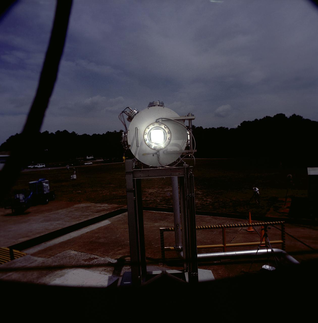 Researchers at the Marshall Space Flight Center (MSFC) have designed, fabricated, and tested the first solar thermal engine, a non-chemical rocket engine that produces lower thrust but has better thrust efficiency than a chemical combustion engine. MSFC turned to solar thermal propulsion in the early 1990s due to its simplicity, safety, low cost, and commonality with other propulsion systems. Solar thermal propulsion works by acquiring and redirecting solar energy to heat a propellant. The 20- by 24-ft heliostat mirror (not shown in this photograph) has dual-axis control that keeps a reflection of the sunlight on an 18-ft diameter concentrator mirror, which then focuses the sunlight to a 4-in focal point inside the vacuum chamber. The focal point has 10 kilowatts of intense solar power. This photograph is a close-up view of a 4-in focal point inside the vacuum chamber at the MSFC Solar Thermal Propulsion Test facility. As part of MSFC's Space Transportation Directorate, the Propulsion Research Center serves as a national resource for research of advanced, revolutionary propulsion technologies. The mission is to move the Nation's capabilities beyond the confines of conventional chemical propulsion into an era of aircraft-like access to Earth orbit, rapid travel throughout the solar system, and exploration of interstellar space.