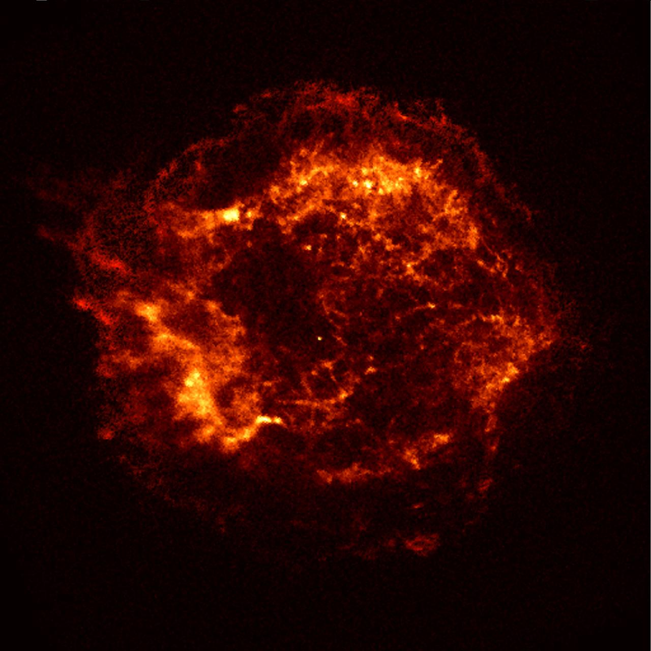 This x-ray image of the Cassiopeia A (CAS A) supernova remnant is the official first light image of the Chandra X-Ray Observatory (CXO). The 5,000-second image was made with the Advanced Charged Coupled Device (CCD) Image Spectrometer (ACIS). Two shock waves are visible: A fast outer shock and a slower irner shock. The inner shock wave is believed to be due to the collision of ejecta from the supernova explosion with a circumstellar shell of material, heating it to a temperature of 10 million-degrees Celsius. The outer shock wave is analogous to an awesome sonic boom resulting from this collision The x-rays reveal a bright object near the center, which may be the long-sought neutron star or black hole remnant of the explosion that produced Cassiopeia A. Cassiopeia A is the 320-year-old remnant of a massive star that exploded. Located in the constellation Cassiopeia, it is 10 light-years across and 10,000 light-years from Earth. A supernova occurs when a massive star has used up its nuclear fuel and the pressure drops in the central core of the star. The matter in the core is crushed by gravity to higher and higher densities, and temperatures reach billions of degrees. Under these extreme conditions, nuclear reactions occur violently and catastrophically, reversing the collapse. A thermonuclear shock wave races through the now expanding stellar debris, fusing lighter elements into heavier ones and producing a brilliant visual outburst.