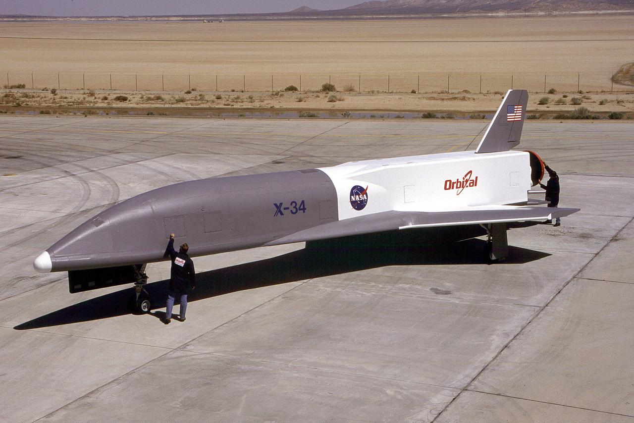 Pictured is the X-34 Demonstrator parked on the runway. Part of the Pathfinder Program, the X-34 was a reusable technology testbed vehicle that was designed and built by the Marshall Space Flight Center to demonstrate technologies that are essential to lowering the cost of access to space. Powered by a LOX and RP-1 liquid Fastrac engine, the X-34 would be capable of speeds up to Mach 8 and altitudes of 250,000-feet. The X-34 program was cancelled in 2001.