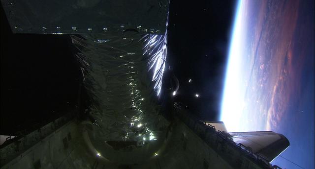 99-E-10019 (23 July 1999) --- The Chandra X-Ray observatory was recorded with the STS-93 HDTV Camcorder as it moved from its stowed position in the cargo bay of the Space Shuttle Columbia. Deployment of the giant telescope occurred only hours after the shuttle reached Earth orbit.