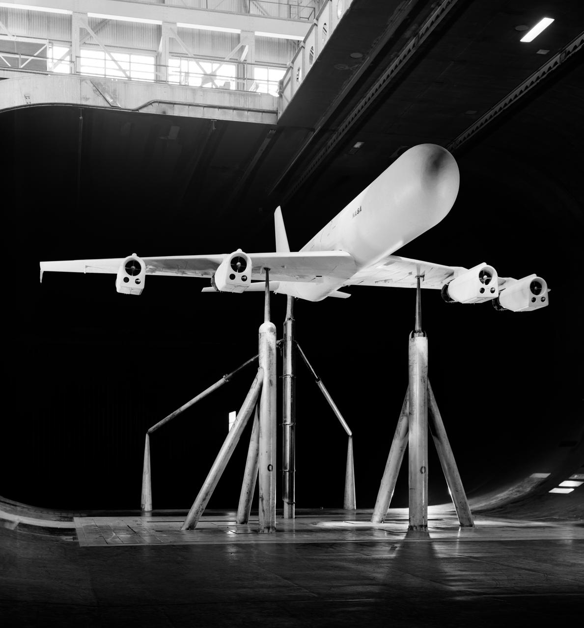 Effects of thrust reversers on the aerodynamics characteristics of a four-engine jet transport model. 1/4 front view on normal struts with thrust reversers.