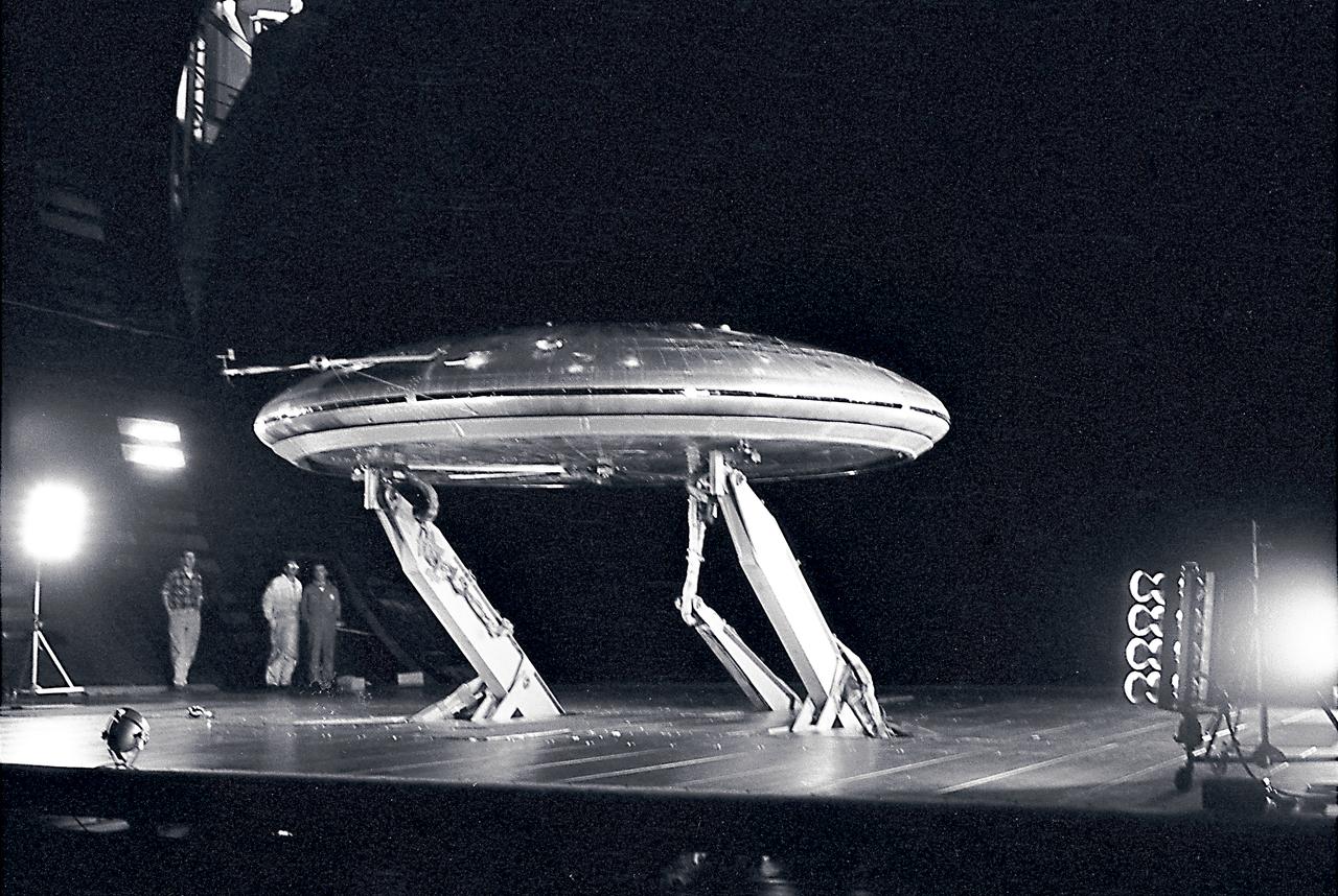 Front 3/4 view of the Avrocar mounted on variable height struts in the Ames 40x80 foot wind tunnel, without tail.