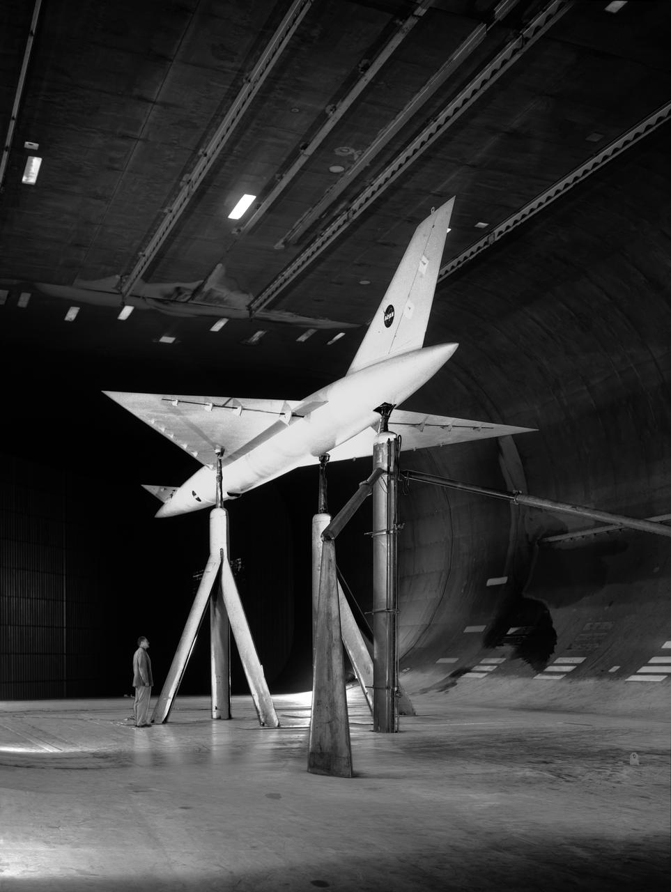 Low Speed investigation of a supersonic transport model with delta wing and delta conard, in the 40x80 Wind Tunnel. R 975 T  Zero angel of attack.  3/4 rear view from below.