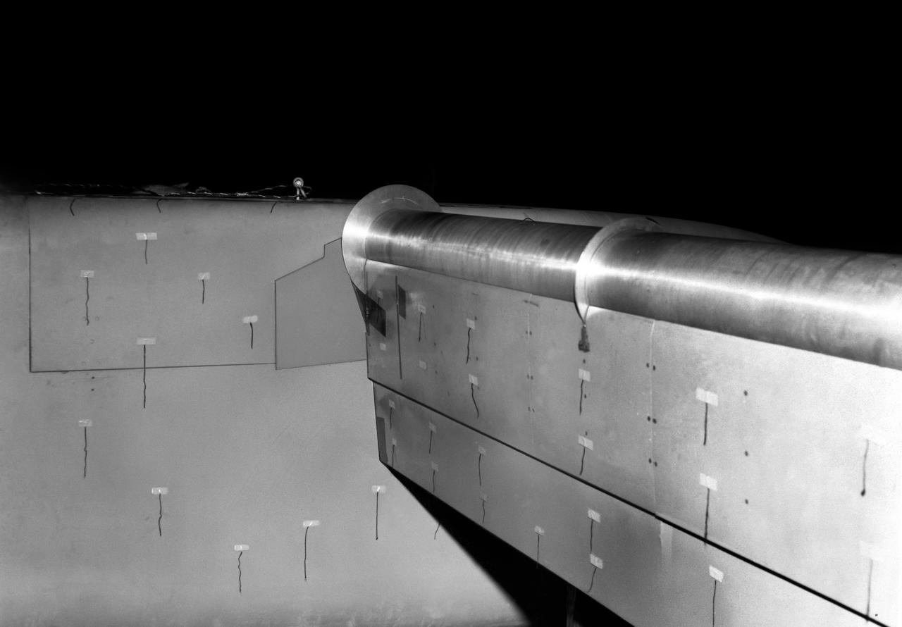 Detail view of 4 propeller model rotating cylinder flap at 90 degrees with yarn tufts attached.