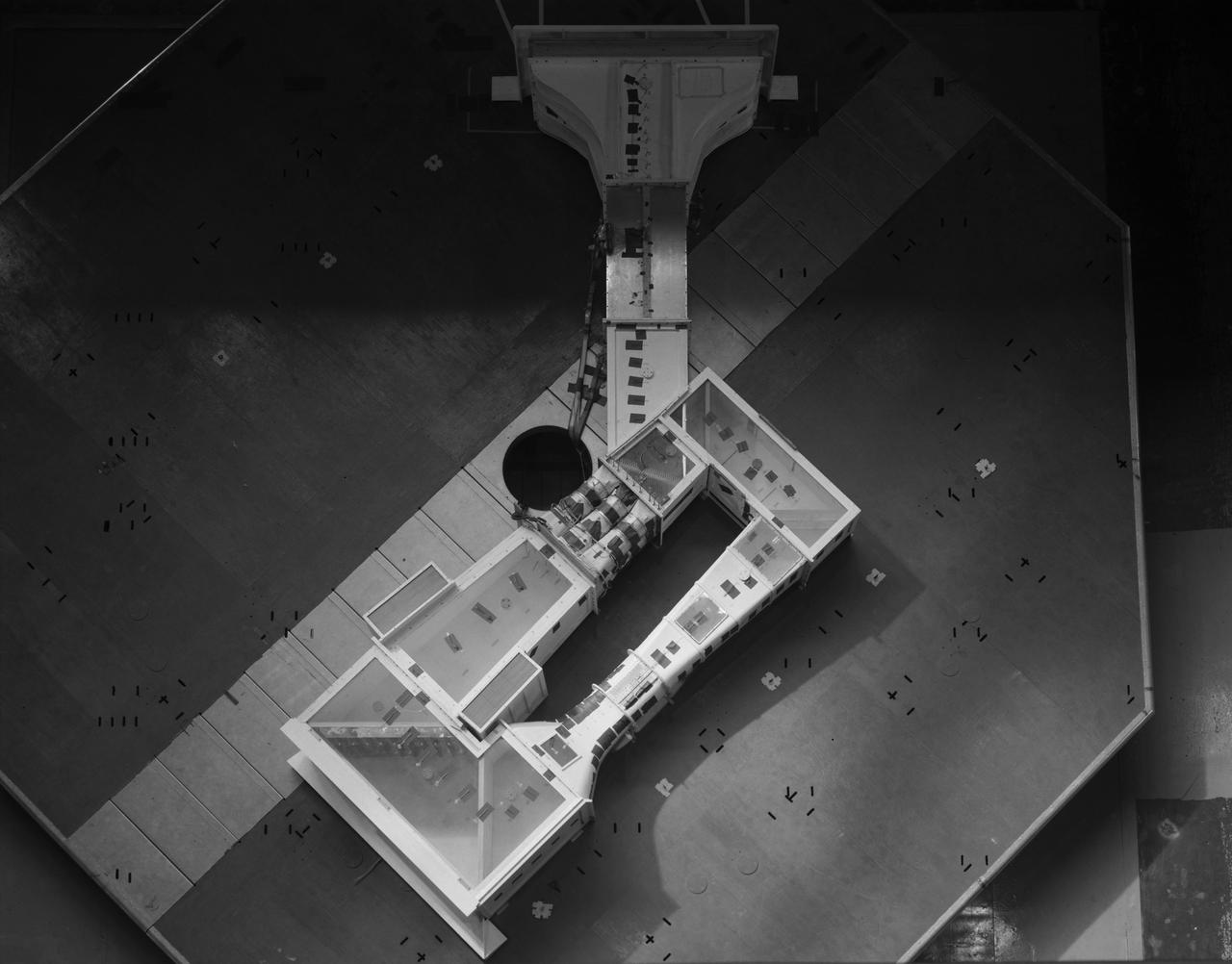 (03/12/1976) Overhead view of 1/50 scale model of the 80x120 foot wind tunnel model (NFAC) in the test section of the 40x80 wind tunnel at NASA Ames. Model mounted on a rotating ground board designed for this test.