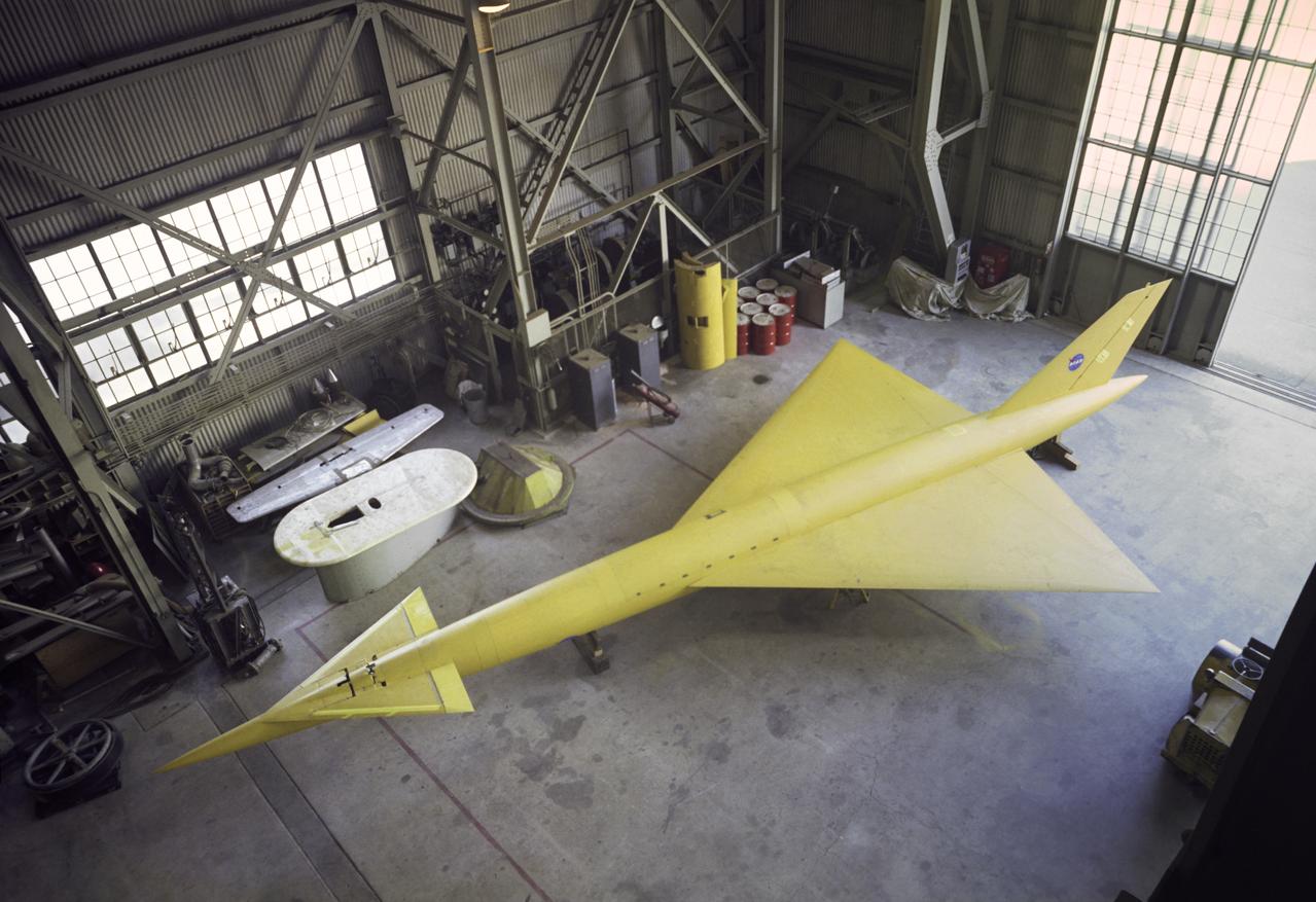 Supersonic transport model test in 40x80 foot wind tunnel, 3/4 overhead view of model in shop floor.  04/06/1961 R 975 T
