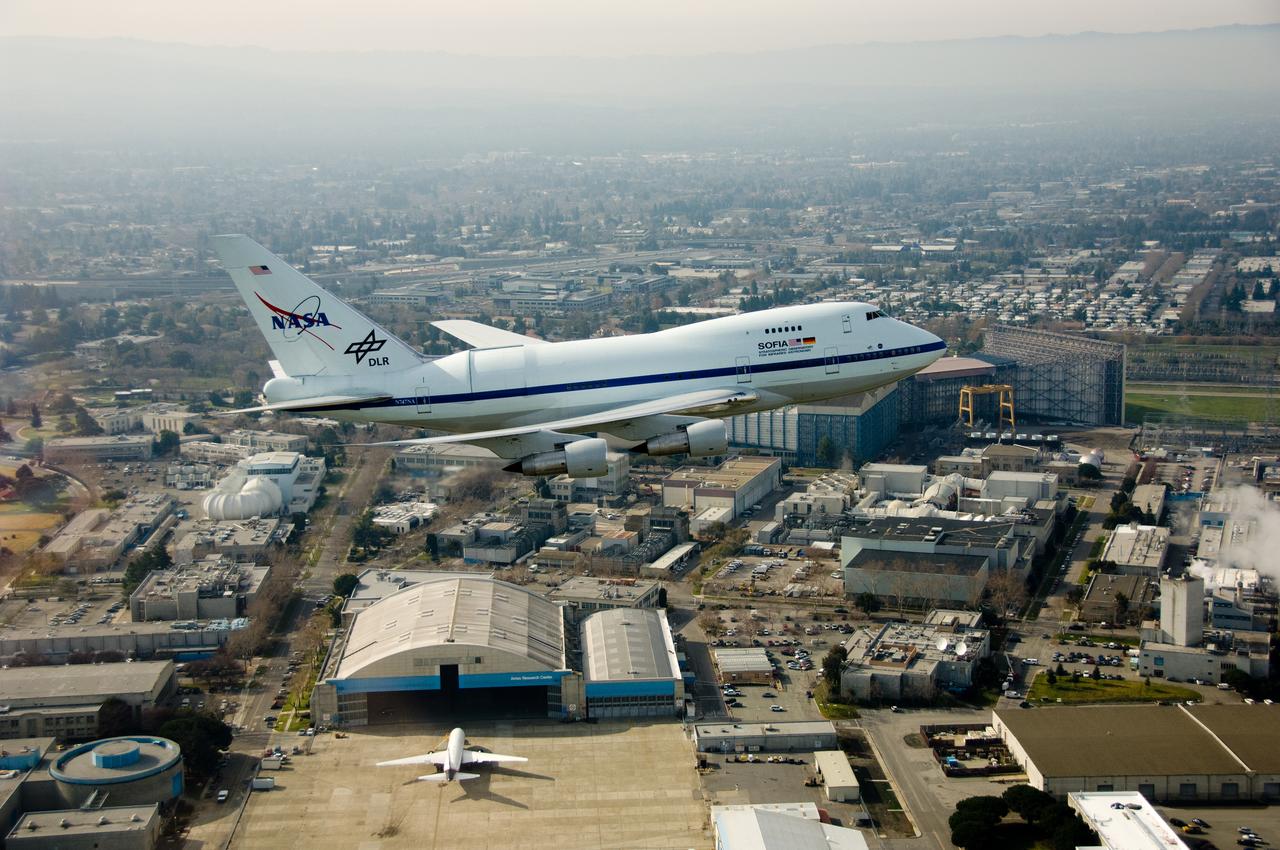 Air to air view of the Stratospheric Observatory for Infrared Astronomy or SOFIA aircraft fly-by on a visit to Ames Research Center