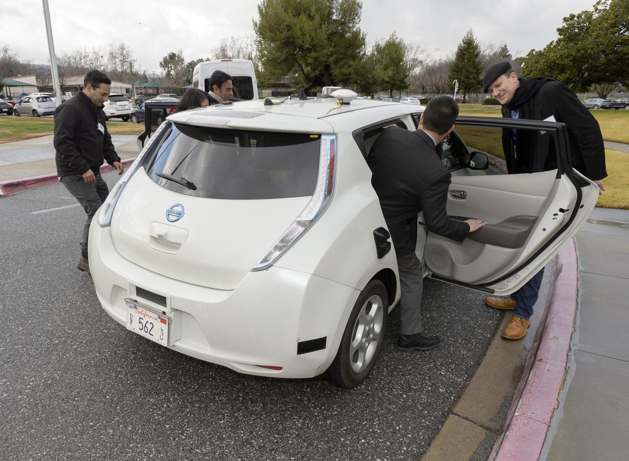 Senior executives from the Renault-Nissan Alliance, including Carlos Ghosn, chairman and CEO of Nissan, and Jose Munoz, chairman of Nissan North America, visited Ames for meetings and a showcase of the technical partnership between NASA and Nissan North America. The partnership allows researchers to develop and test autonomy algorithms, concepts, and integrated prototypes for a variety of vehicular transport applications – from rovers to self-driving cars.  After briefings, a company of including Eugene Tu, Ames Center Director andLiam Pedersen, Nissan on right  Carlos Ghosn, CE, Nissan on left climb into in the autonomous vehicle to  observed testing of Nissan’s all-electric LEAF as it performed safe autonomous drives across the center.