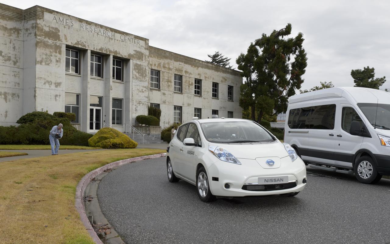 Senior executives from the Renault-Nissan Alliance, including Carlos Ghosn, chairman and CEO of Nissan, and Jose Munoz, chairman of Nissan North America, visited Ames for meetings and a showcase of the technical partnership between NASA and Nissan North America. The partnership allows researchers to develop and test autonomy algorithms, concepts, and integrated prototypes for a variety of vehicular transport applications – from rovers to self-driving cars.  After briefings, a group take a ride in the autonomous vehicle to  observed testing of Nissan’s all-electric LEAF as it performed safe autonomous drives across the center.