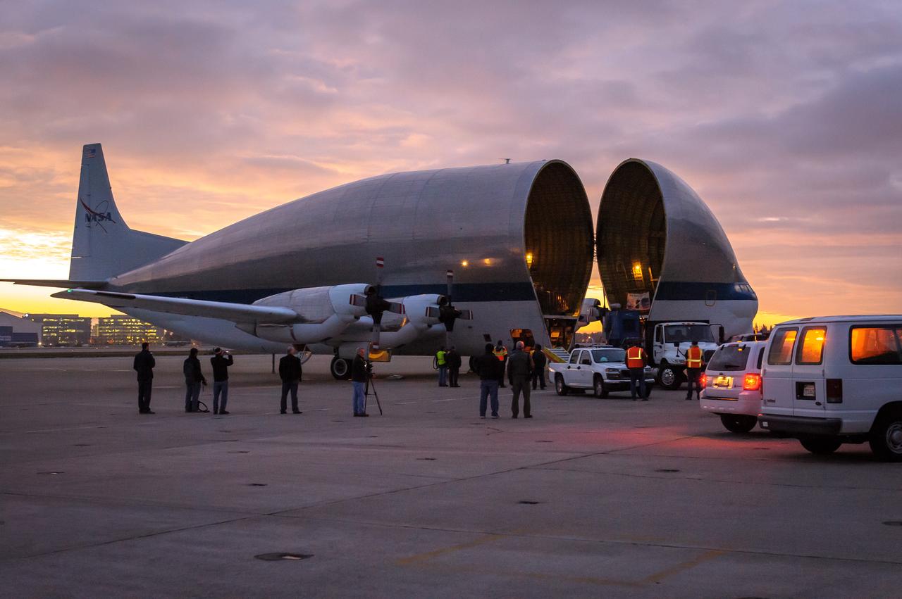 NASA N941NA Superguppy lands at the Moffett Field.  Cargo is loaded into the Super Guppy when the aircraft's "fold-away" nose rotates 110 degrees to the left, allowing unobstructed access to the 25 foot diameter fuselage.