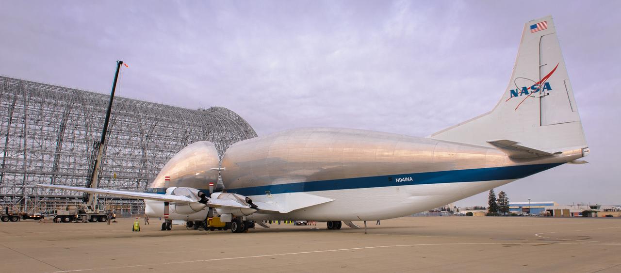 NASA N941NA parked in front of Hangar 1 at Moffett Field.  Cargo is loaded into the Super Guppy when the aircraft's "fold-away" nose rotates 110 degrees to the left, allowing unobstructed access to the 25 foot diameter fuselage.