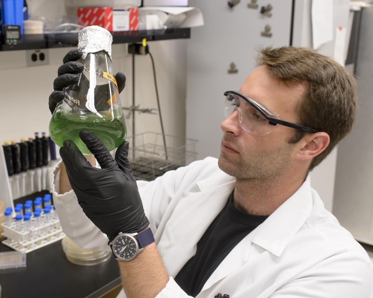 EuCROPIS EVT-2 Power Cell in N-239 Lab Ryan Kent with Flask containing Anabaena Culture
