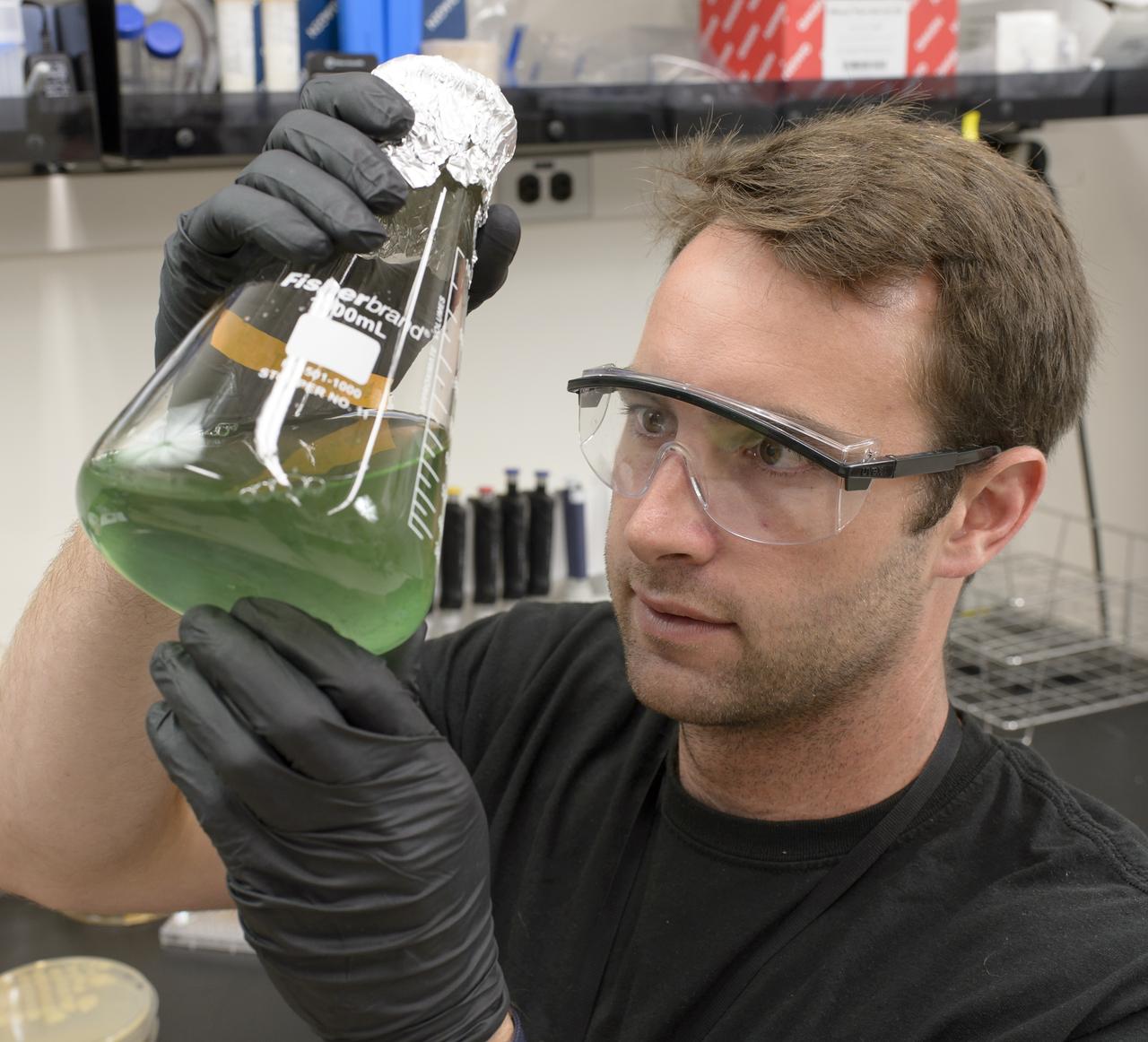 EuCROPIS EVT-2 Power Cell in N-239 Lab Ryan Kent with Flask containing Anabaena Culture