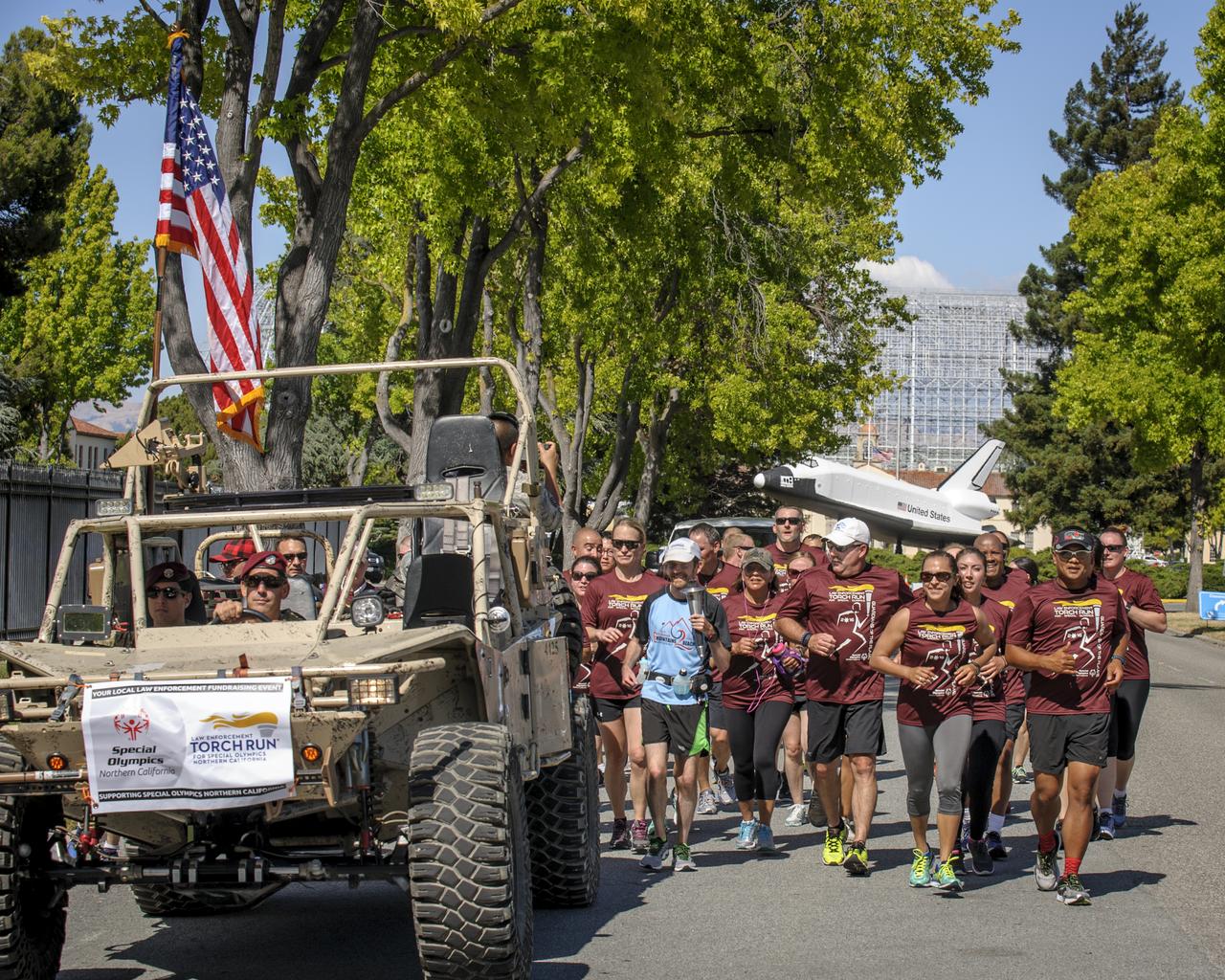 The Special Olympics torch make it's way through the NASA Ames Research Park on it's way to a hand-off in Mountain View, CA