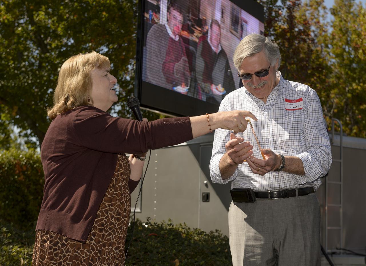 Avation Safety Reporting System (ASRS) 40th Anniversary lunch and open house at the Sunnyvale office.  Linda J. Connell, ASRS Program Director (left); Dr. John Lauber, Resident Scientist and early pioneer of the ASRS at Ames, 1972-1985 (Right).