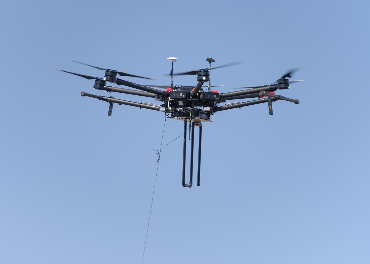 Flight Test in the Roverscape (N-269) at NASA's Ames Research Center, the project team tests the DJI Matrice 600 Unmanned Aerial Vehicle (UAV) equipped with a radio tracking receiver to study the invasive asian carp in the Mississippi River.