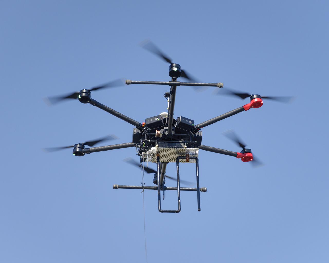 Flight Test in the Roverscape (N-269) at NASA's Ames Research Center, the project team tests the DJI Matrice 600 Unmanned Aerial Vehicle (UAV) equipped with a radio tracking receiver to study the invasive asian carp in the Mississippi River.