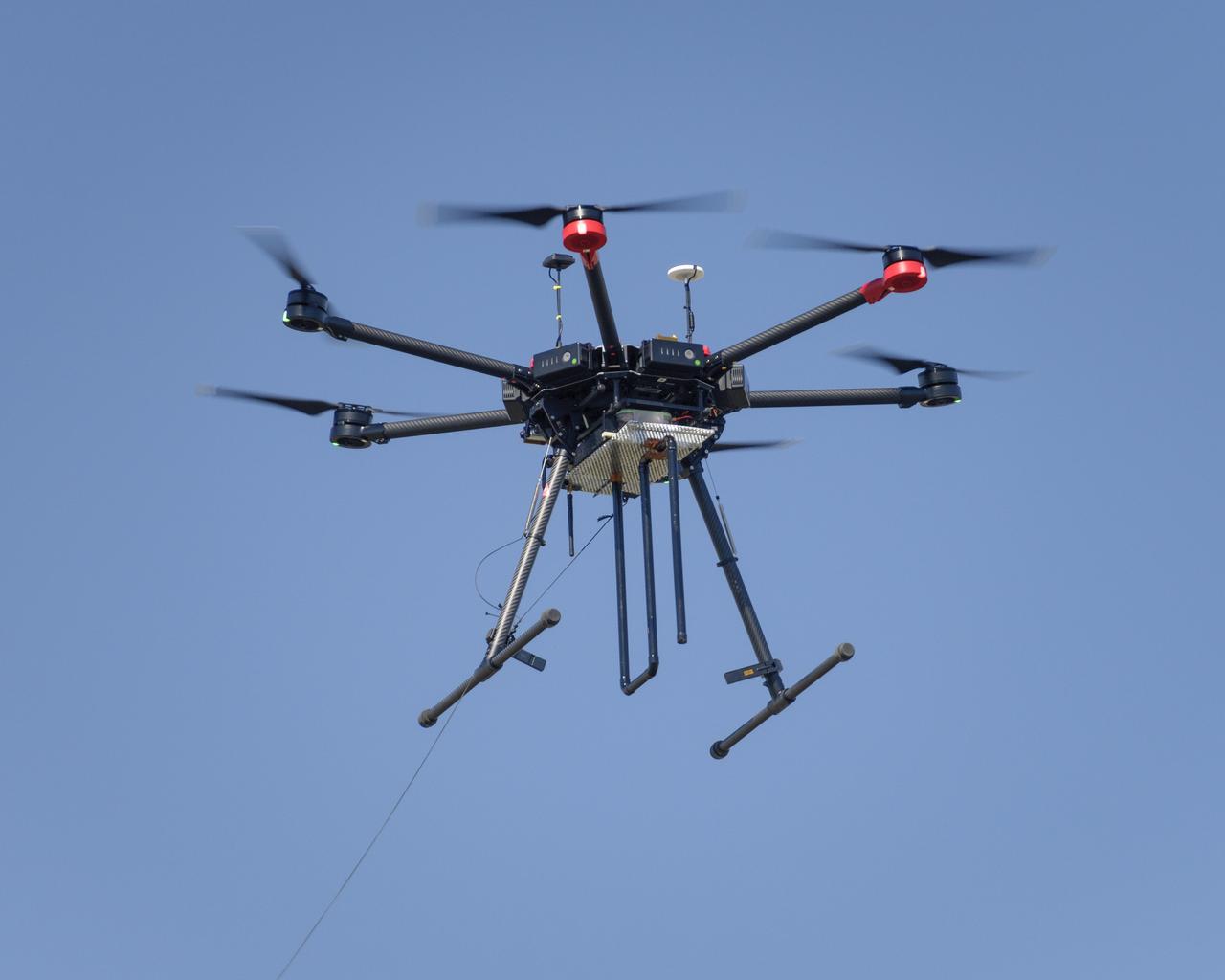 Flight Test in the Roverscape (N-269) at NASA's Ames Research Center, the project team tests the DJI Matrice 600 Unmanned Aerial Vehicle (UAV) equipped with a radio tracking receiver to study the invasive asian carp in the Mississippi River.