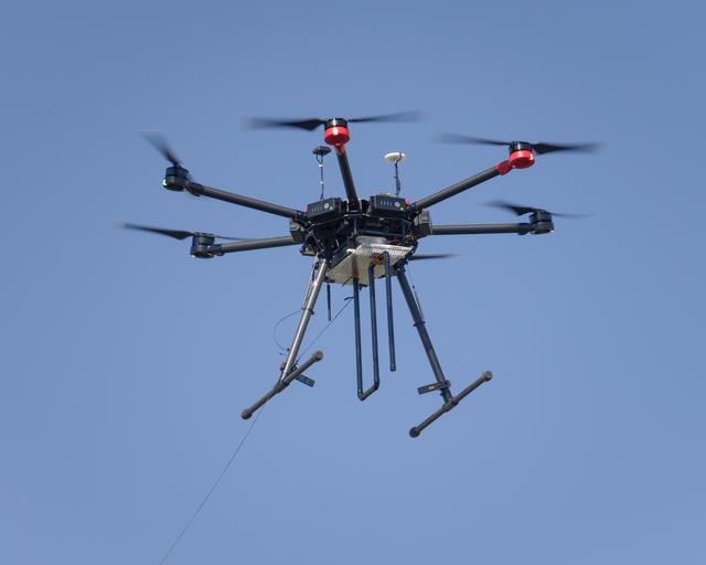 NASA image: The Earth Science Unmanned Aerial System (UAS) Demonstration in the Rover Scape at NASA's Ames Research Center.