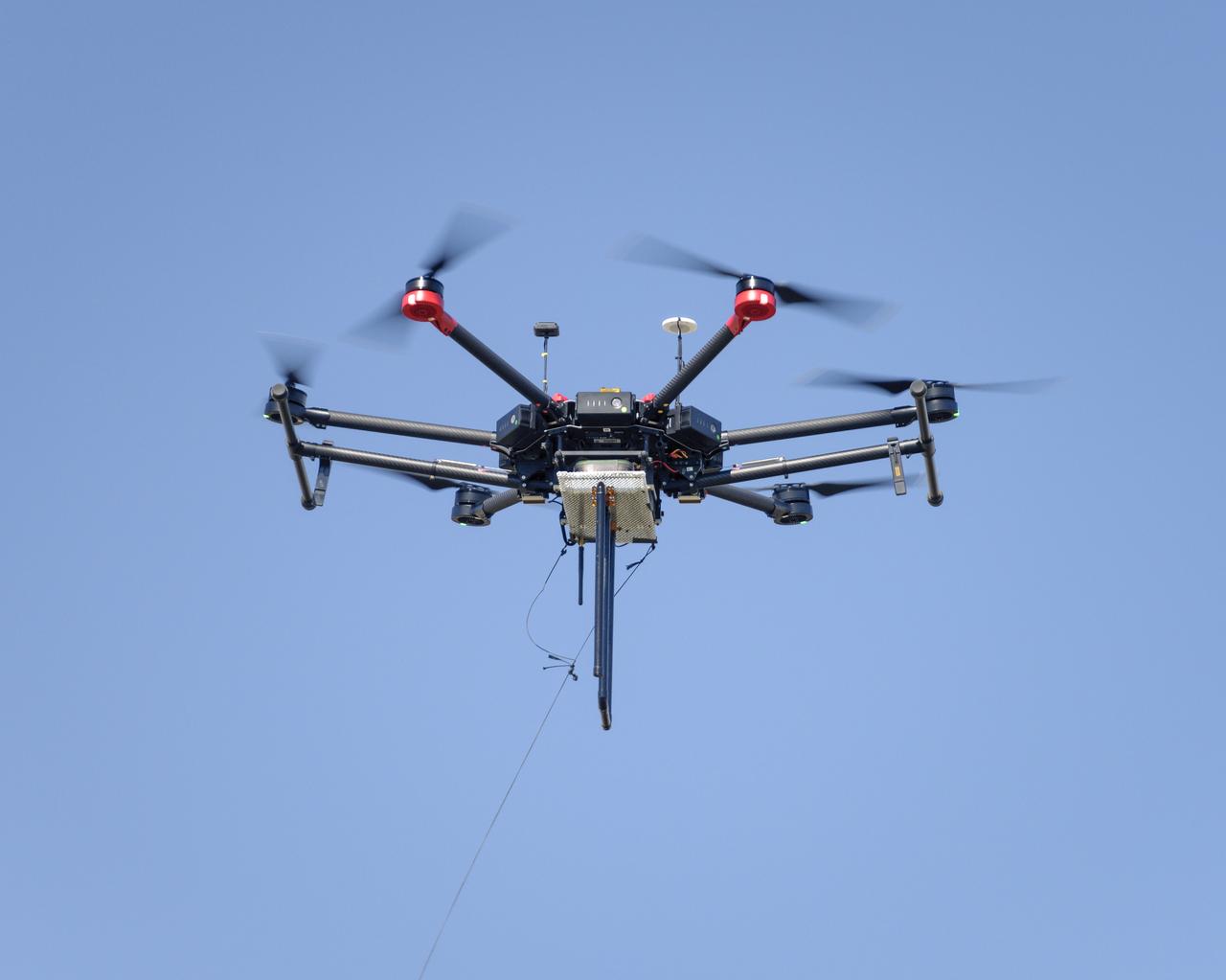 Flight Test in the Roverscape (N-269) at NASA's Ames Research Center, the project team tests the DJI Matrice 600 Unmanned Aerial Vehicle (UAV) equipped with a radio tracking receiver to study the invasive asian carp in the Mississippi River.