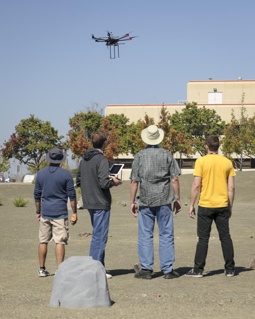 Flight Test in the Roverscape (N-269) at NASA's Ames Research Center, the project team tests the DJI Matrice 600 Unmanned Aerial Vehicle (UAV) equipped with a radio tracking receiver to study the invasive asian carp in the Mississippi River.