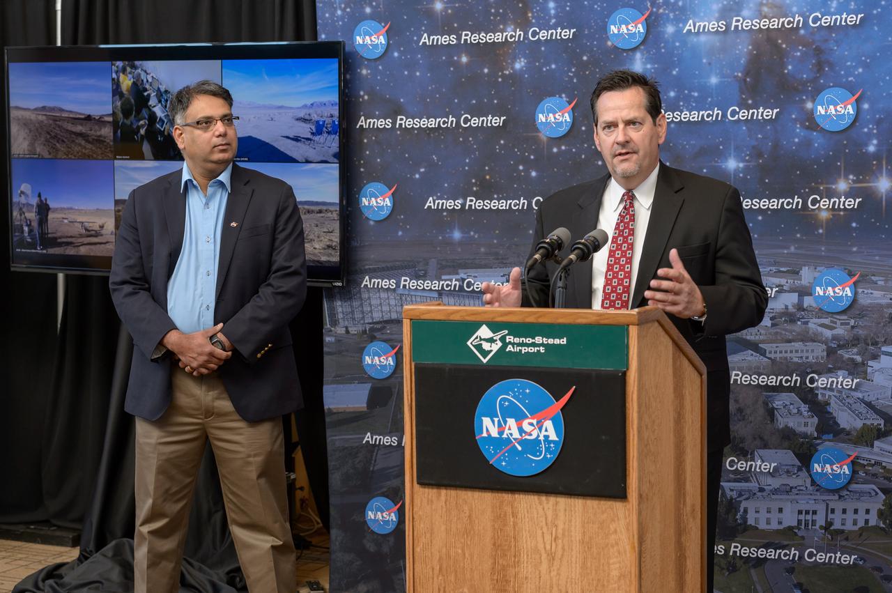 News Conference following the test of Unmanned Aircraft Systems Traffic Management (UTM) technical capability Level 2 (TCL2) at Reno-Stead Airport, Nevada.  Parimal Kopardekar, NASA Ames Senior Engineer for Ait Transportation Systems gave an overview of UTM (Left). Tom Wilczek, Aerospace and Defence industry representative and Nevada Govenor's Office of Economic Development (Right). 