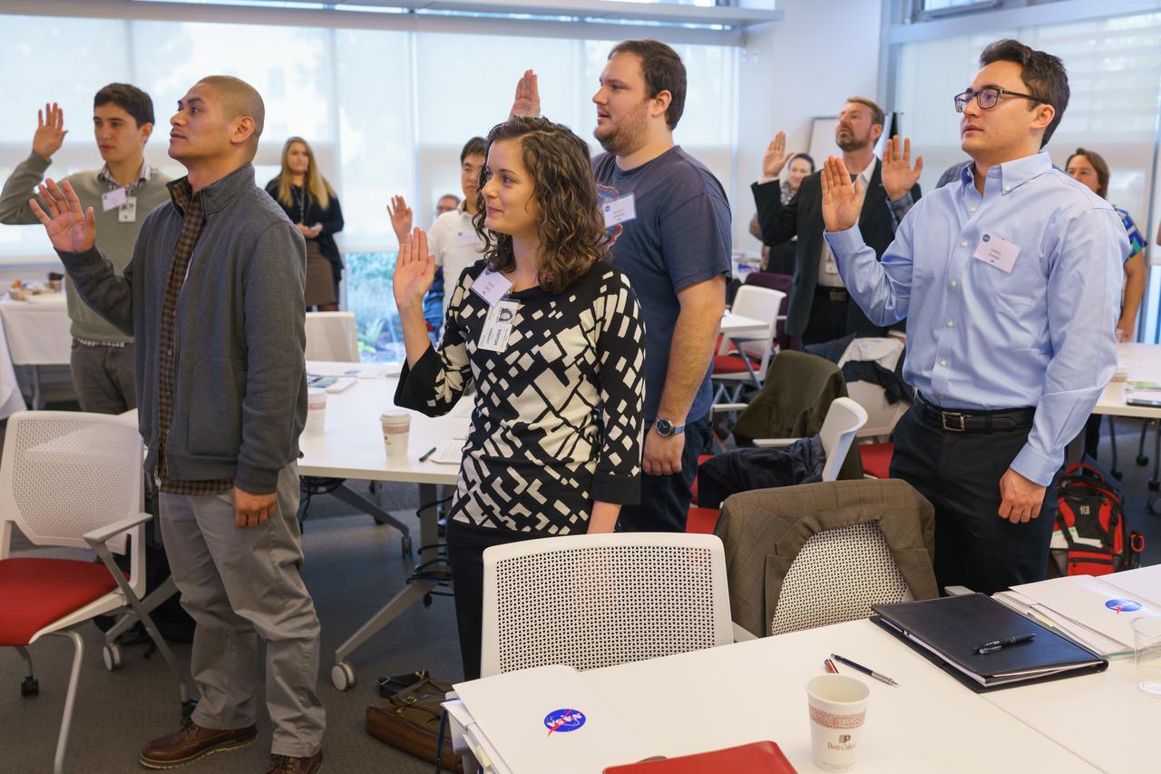 New Employee orientation and swearing-in, left to right (far left) unknow) Tracie Perez, Spenser Monheim (behind Tracie) and Daniel Chang 