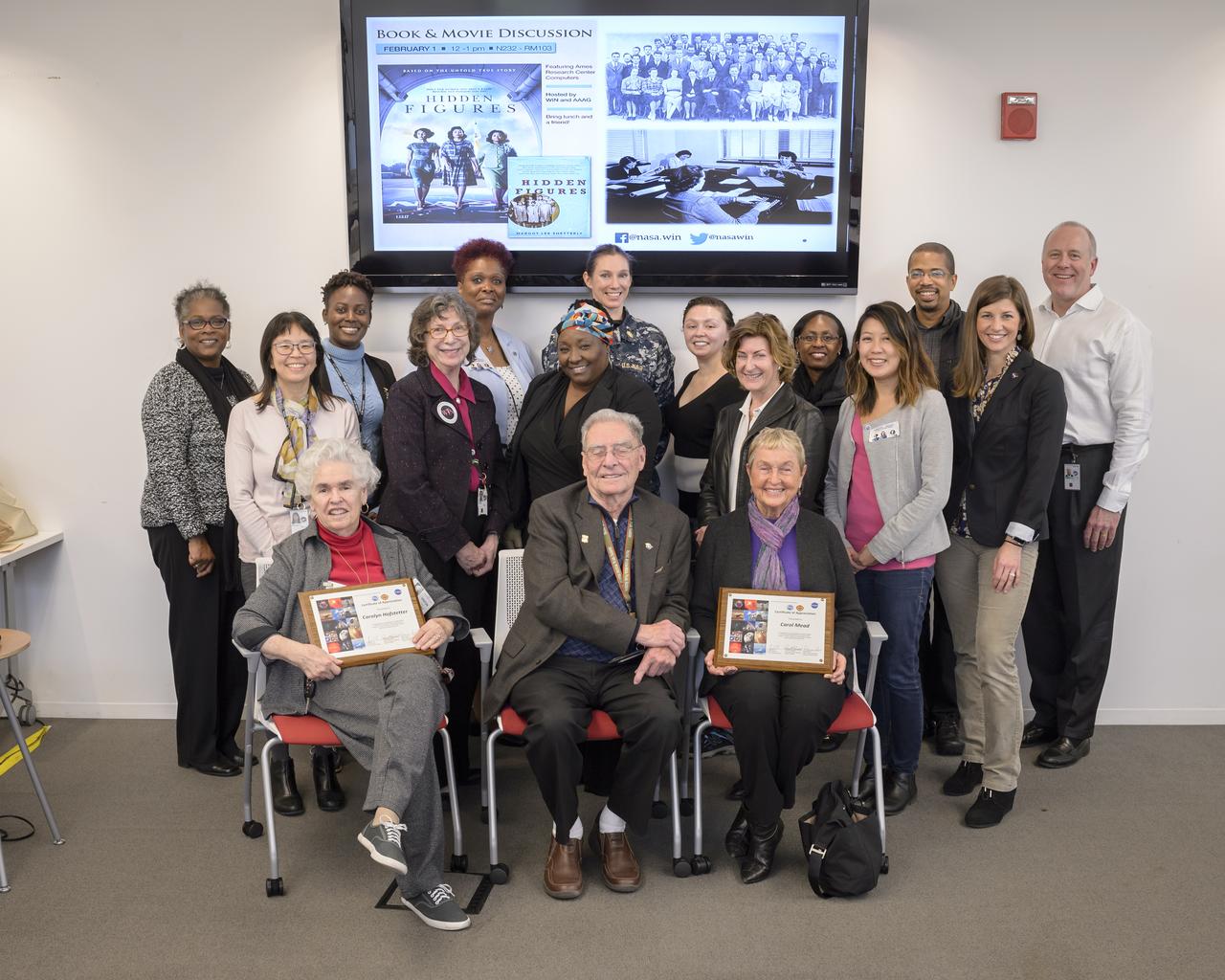Ames Women's Influence Network (WIN) Hidden Figures talk with "Computers" Carolyn Hofstetter and Carol Mead co-sponsored by the AAAG. Group photo Front Row left to right; Carolyn Hofstetter, Jack Boyd, Carol Mead  Middle Row: Kathy Lee, Annette Randall, Trincella Lewis, Ann Mead (daughter to Carol Mead), Vanessa Kuroda, Netti Halcomb Roozeboom  Back Row; Dr Barbara Miller, Dr Wendy Okolo, Denise Snow, Leedjia Svec, Erika Rodriquez, Rhonda Baker, Ray Gilstrap, Glenn Bugos