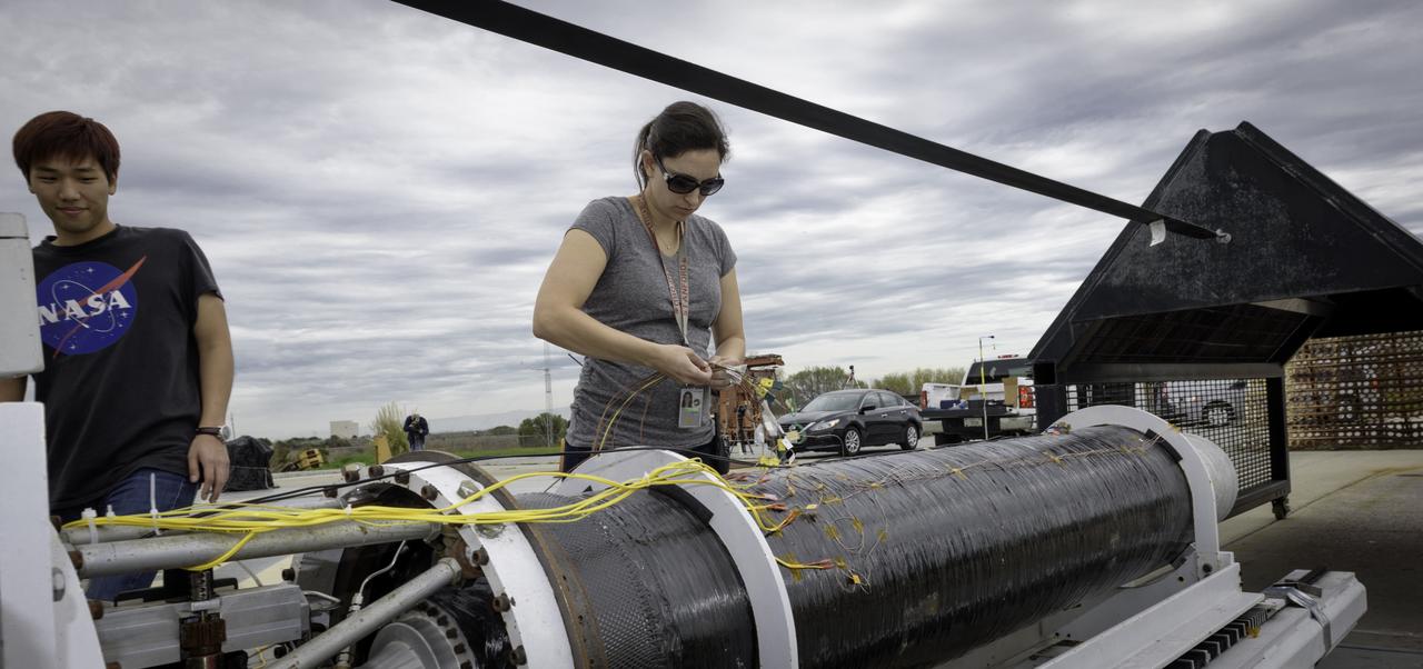 Hunjoo Kim, NASA JPL, (Left) Ashley Karp, NASA JPL (Right) preparing the Peregrine Hybrid Rocket Engine at the Outdoor Aerodynamic Research Facility (OARF, N-249).