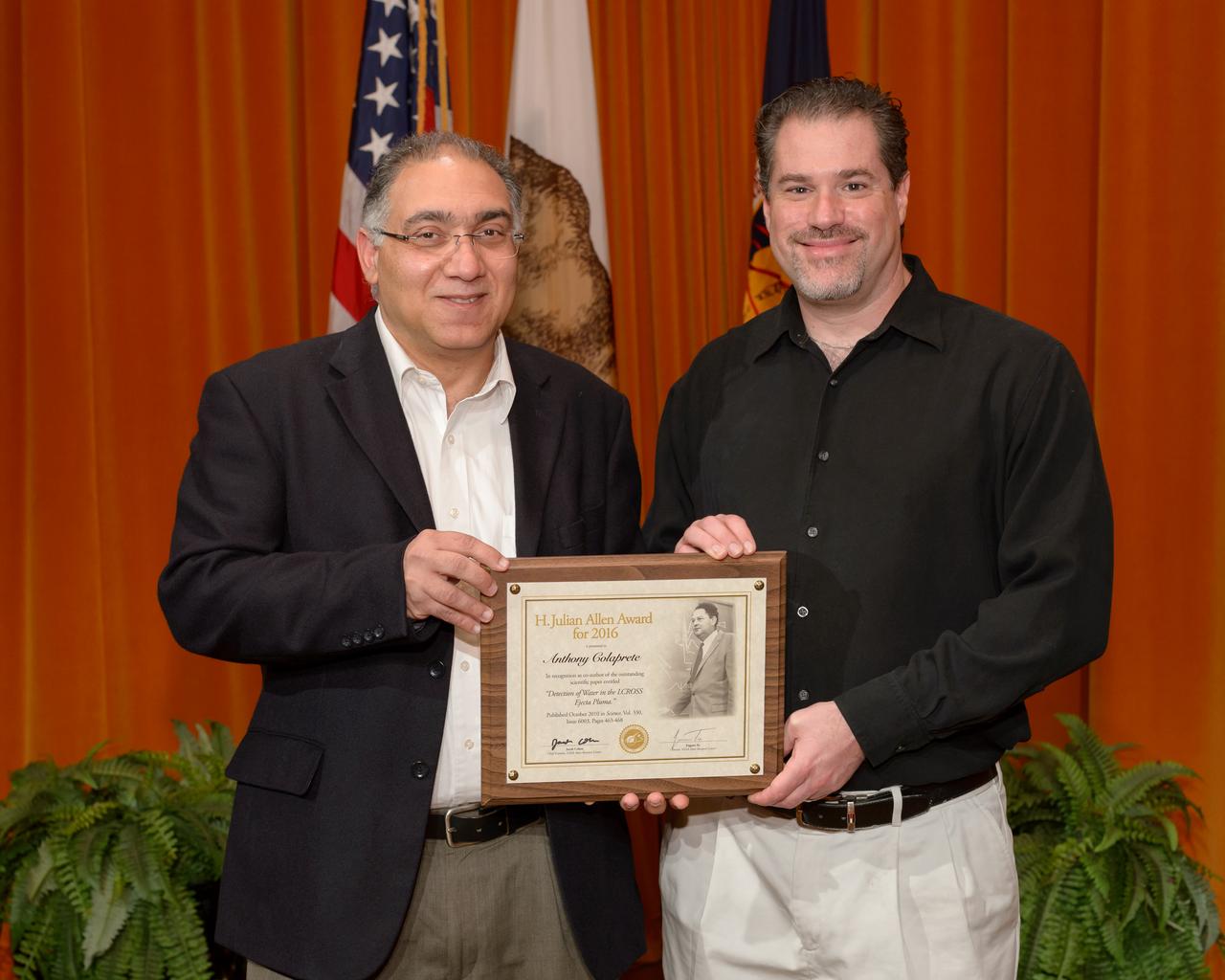 Dr. Jacob Cohen Director Office of Chief Scientist with Dr. Anthony Colaprete recipient of the H. Julian Allen Award In recognition as co-author of the outstanding scientific paper entitled "Detection of Water in the LCROSS Ejecta Pluma." Shown here Dr. Jacob Cohen presents the H. Julian Allen award to Anthony Colaprete.