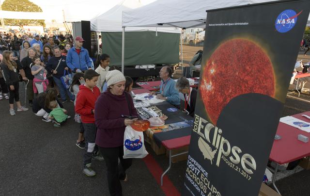 Visitors at the a NASA booth during the 2017 Solar Eclipse viewing event at the Oregon State Farigrounds, Salem, Oregon.