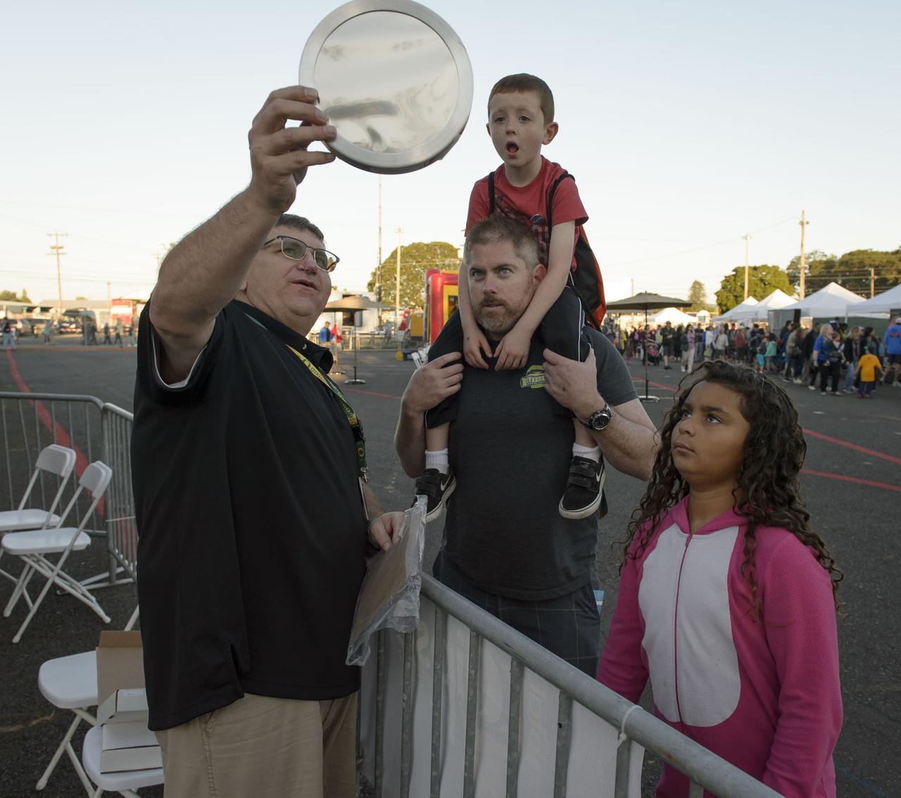 Bill Moede, Howard Video Productions, of the NASA Ames Video group explains how the filter that will be used on the camera to safely photograph the sun during the eclipse.