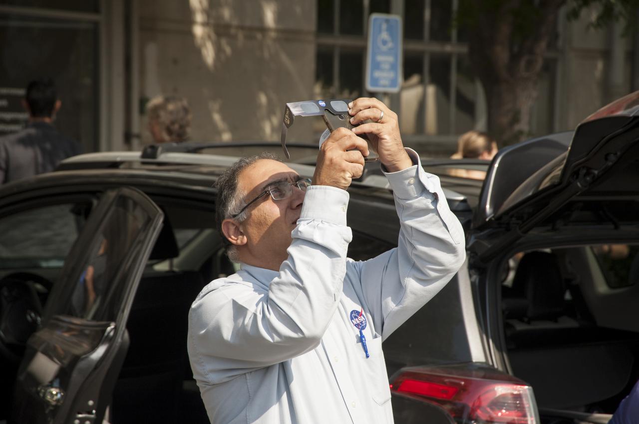Taking a break from his duties at Ames Research Center Jacob Cohen, Ames Chief Scientist grabs his own view of the 2017 Solar Eclipse with his cellphone at 09:16:11 on August 21, 2017.