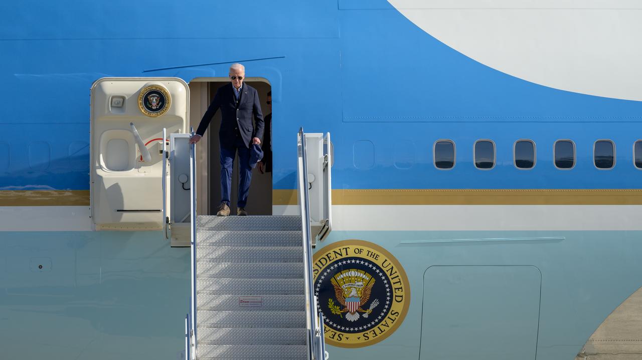 President Joe Biden exits Air Force One at Moffett Federal Airfield before continuing his trip to view consequences of flooding and other storm impacts along California’s central coast.