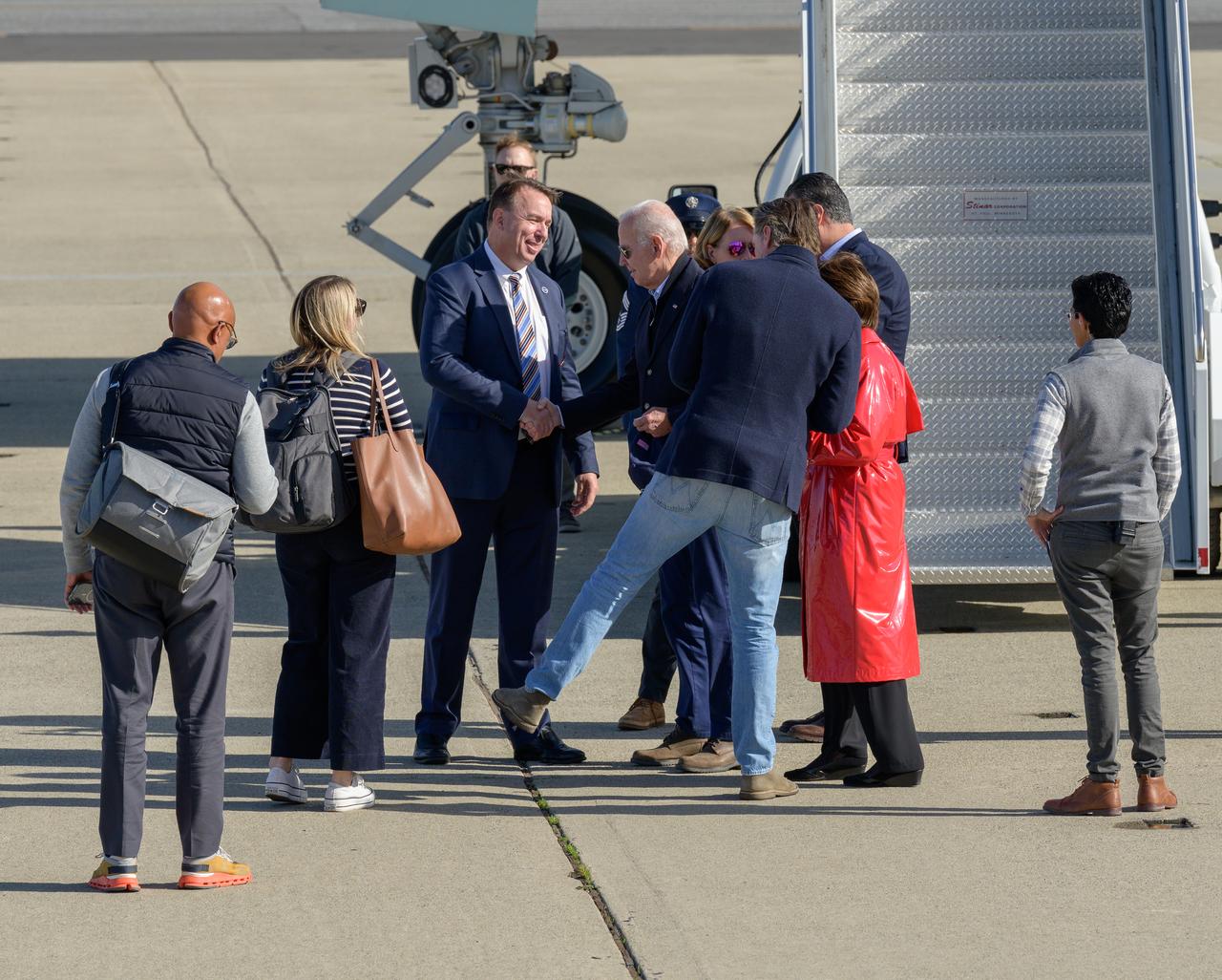 Dr. David Korsmeyer, associate center director for research and technology at Ames, presents an Ames Research Center pin to President Joe Biden in front of Air Force One at Moffett Federal Airfield, near NASA’s Ames Research Center in California’s Silicon Valley, Thursday, Jan. 19, 2023. President Biden was en route to tour recent storm damage in the state.
