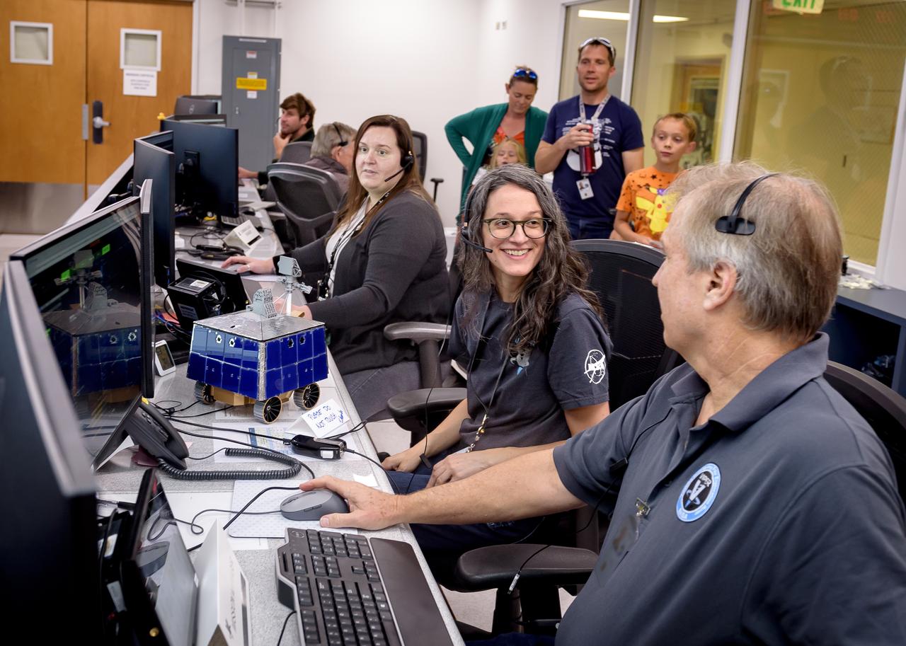 Right to left: Jay Trimble, Rachel Hoover, and Kelsey Herrmann in the Multi-Mission Operations Center (MMOC), N240, during Volatiles Investigating Polar Exploration Rover (VIPER) for VIPER Family Day.