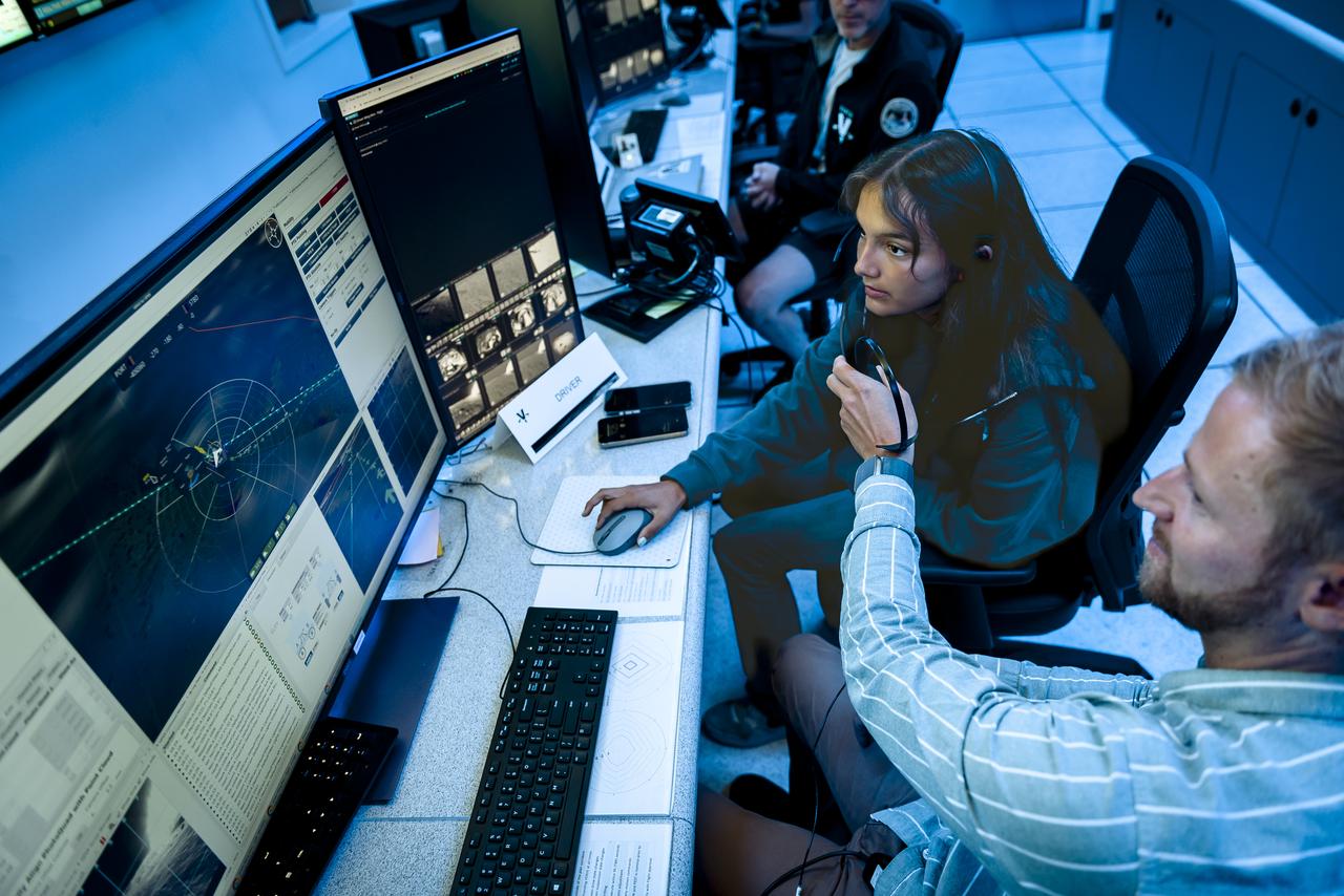 Arno Rogg explains the Volatiles Investigating Polar Exploration Rover (VIPER) mission to visitors in the Multi-Mission Operations Center (MMOC), N240, during VIPER Family Day.