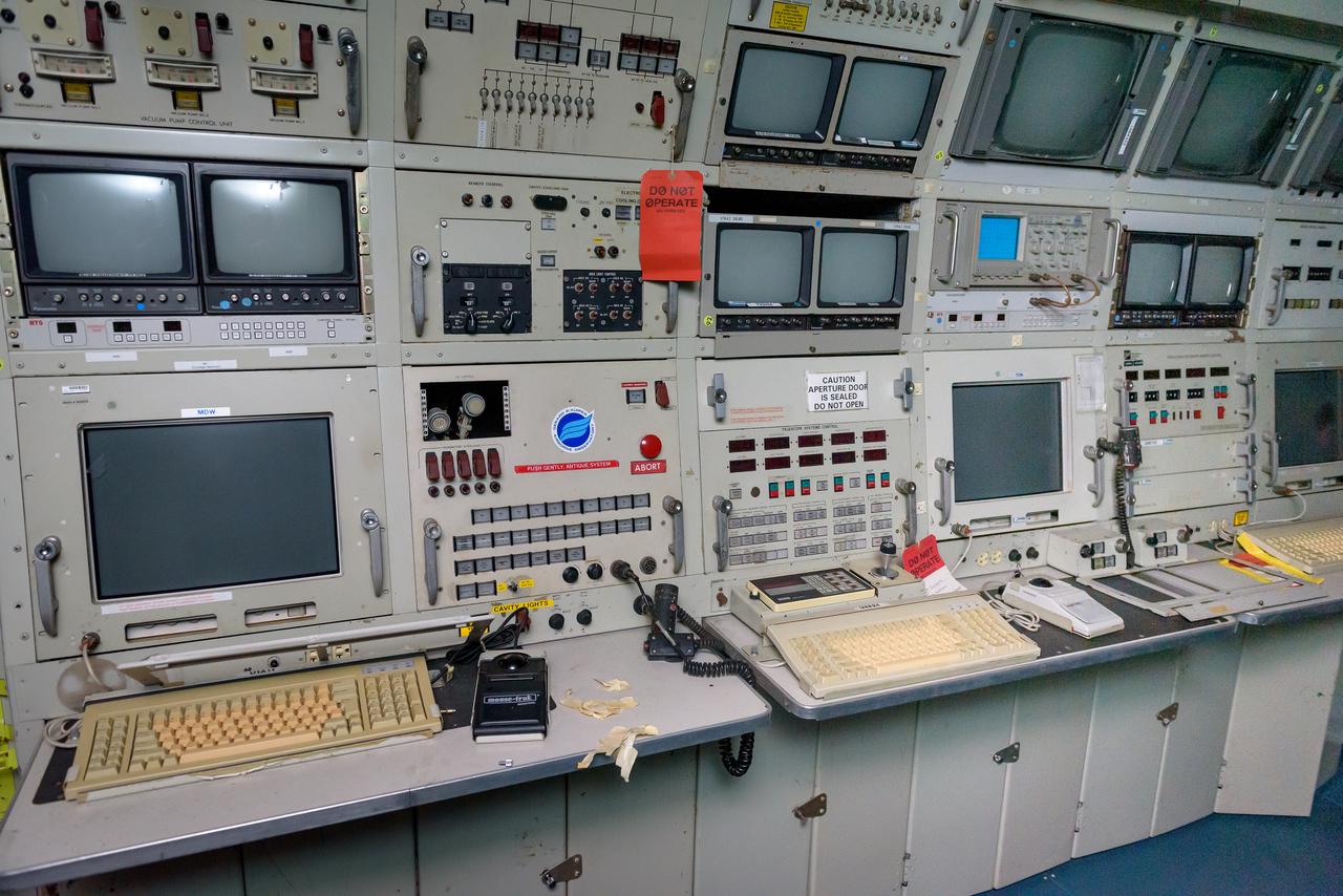 The console holds the mission director’s workstation, left, the telescope operator’s station, and the data systems operator’s station, right, of the Kuiper Airborne Observatory, (KAO) (NASA-714).