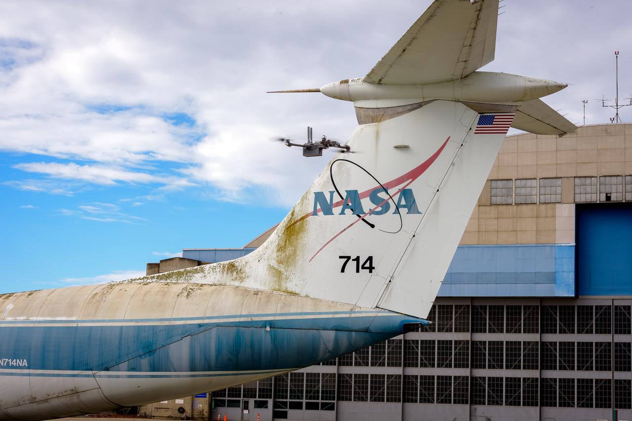 The drone follows an autonomously defined path around the modified C-141 Kuiper Airborne Observatory, (KAO) (NASA-714), on the N211 apron.  The drone photographs the aircraft with a visible and infrared camera which are processed using a photogrammetry software package called Pix4D that converts them into a 3D model.  Scanning the aircraft is the first phase of documenting the aircraft demolition as well as an opportunity to train pilots to operate the Pix4D software.