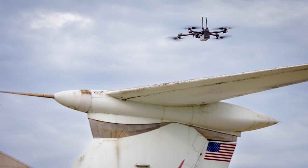 The drone follows an autonomously defined path around the modified C-141 Kuiper Airborne Observatory, (KAO) (NASA-714), on the N211 apron.  The drone photographs the aircraft with a visible and infrared camera which are processed using a photogrammetry software package called Pix4D that converts them into a 3D model.  Scanning the aircraft is the first phase of documenting the aircraft demolition as well as an opportunity to train pilots to operate the Pix4D software.