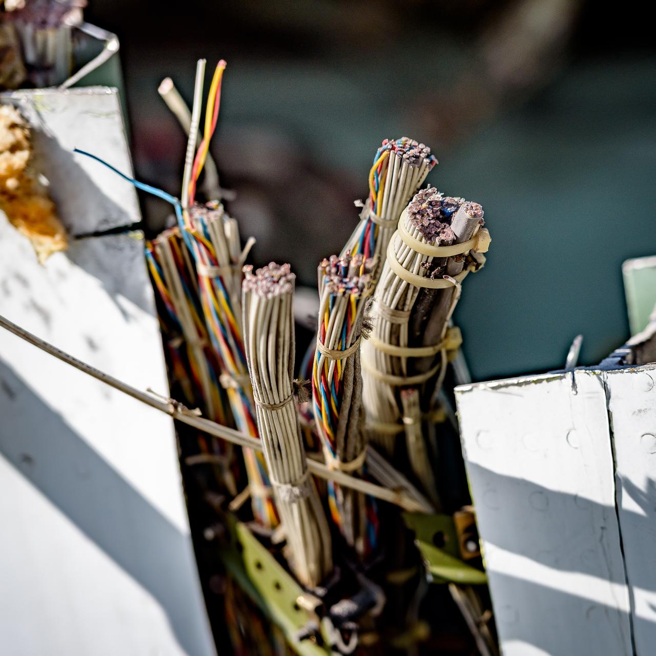 Cables in the modified C-141 Kuiper Airborne Observatory, (KAO) (NASA-714), severed prior to removing the cockpit on the N211 apron at Moffett Field, California.