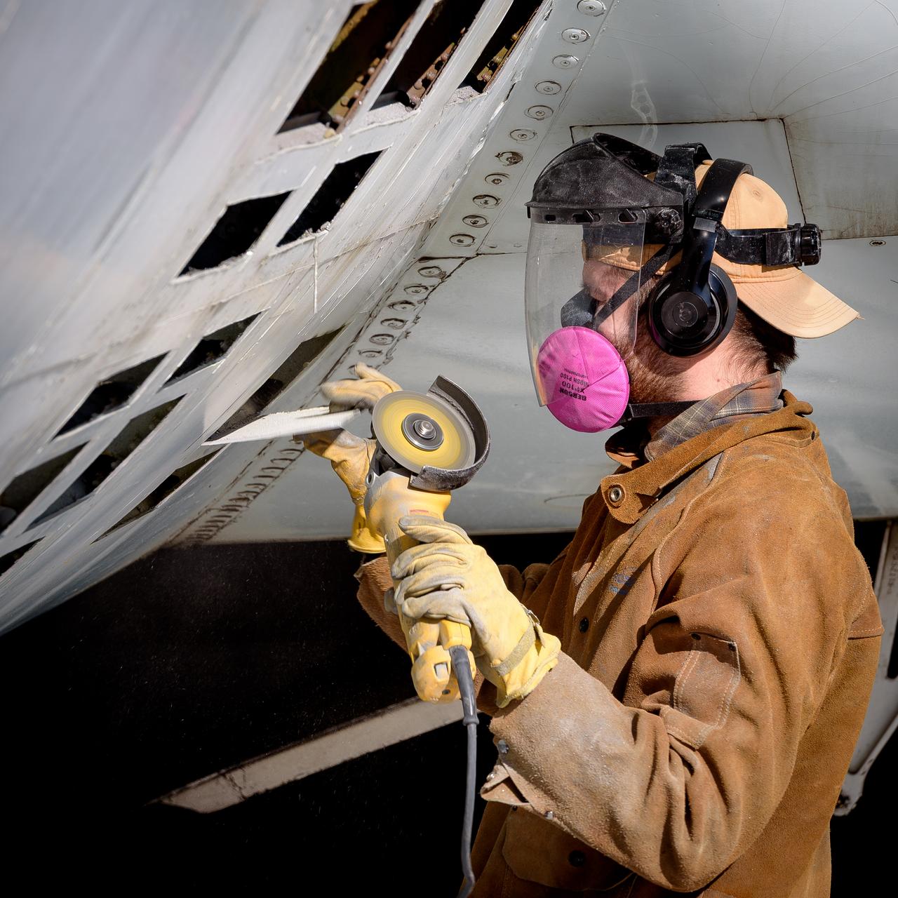 The skin is removed from the airframe of the modified C-141 Kuiper Airborne Observatory, (KAO) (NASA-714), on the N211 apron at Moffett Field, California.