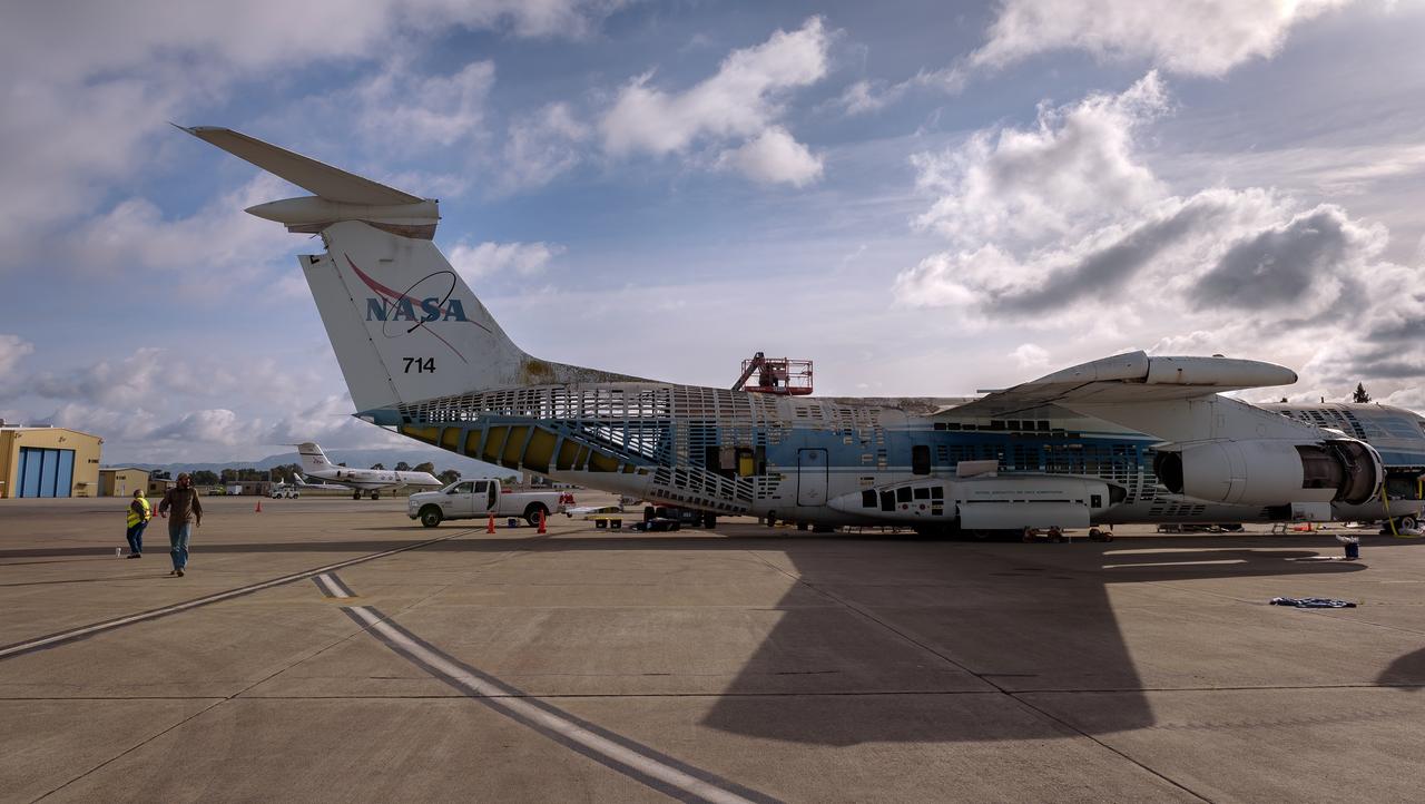 Daylight shines through the airframe during the demolition of the modified C-141 Kuiper Airborne Observatory, (KAO) (NASA-714), tail section on the N211 apron at Moffett Field, California.
