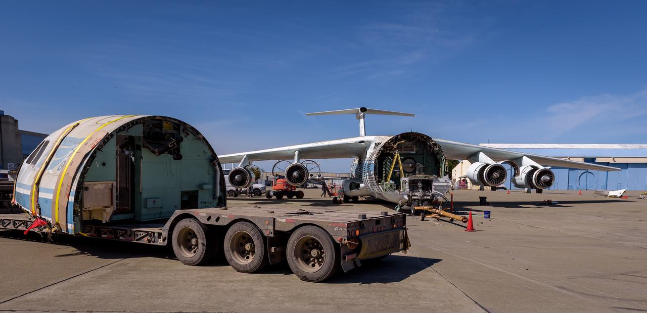 Yellow straps fasten the cockpit of the modified C-141 Kuiper Airborne Observatory, (KAO) (NASA-714), to the trailer that carries it off the N211 apron at Moffett Field, California.
