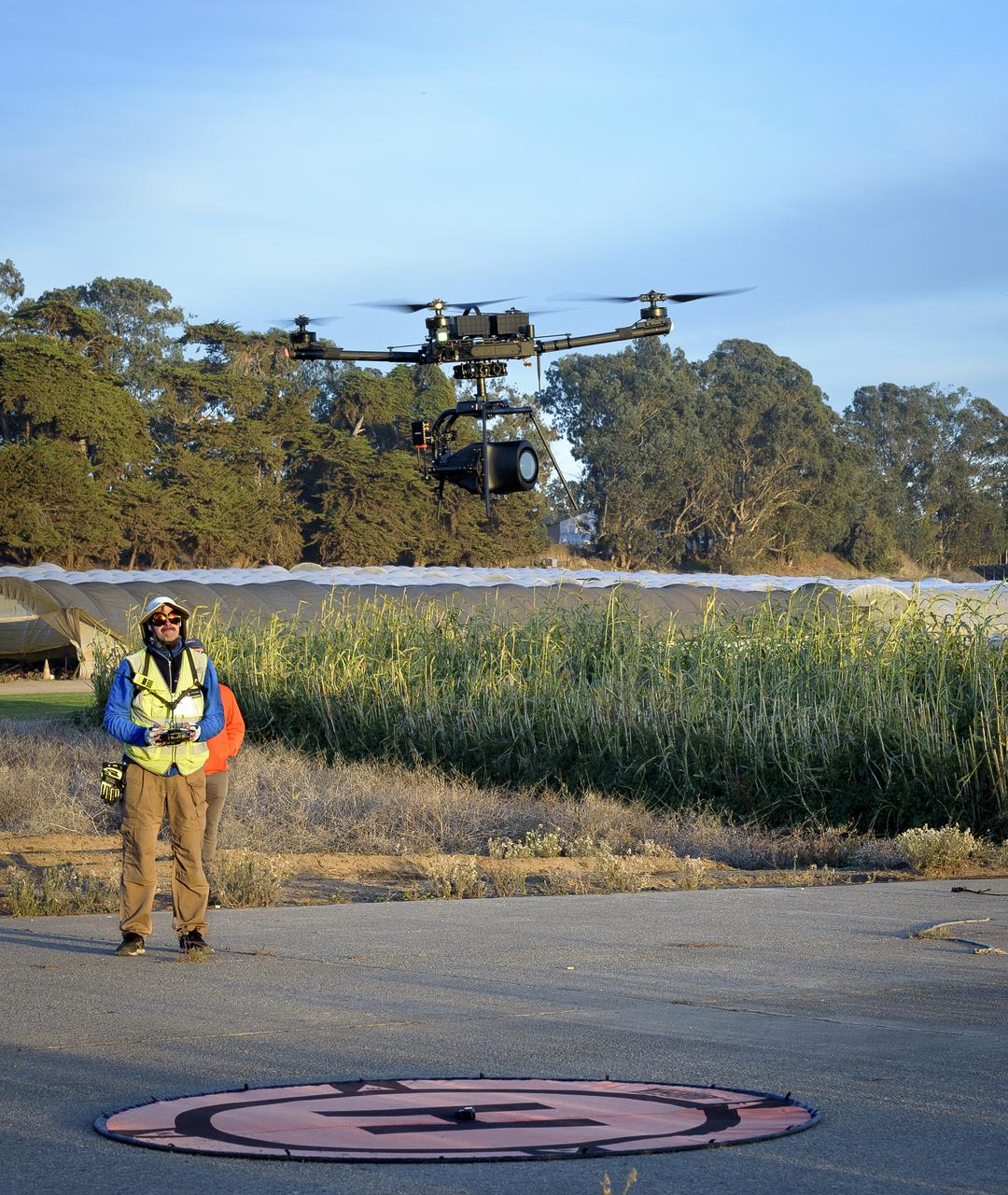 Jonas Jonsson guides the Alta-X Unmanned Aerial Vehicle (UAV) with camera payload down to the landing pad at the Monterey Bay Academy Airport near Watsonville, California.