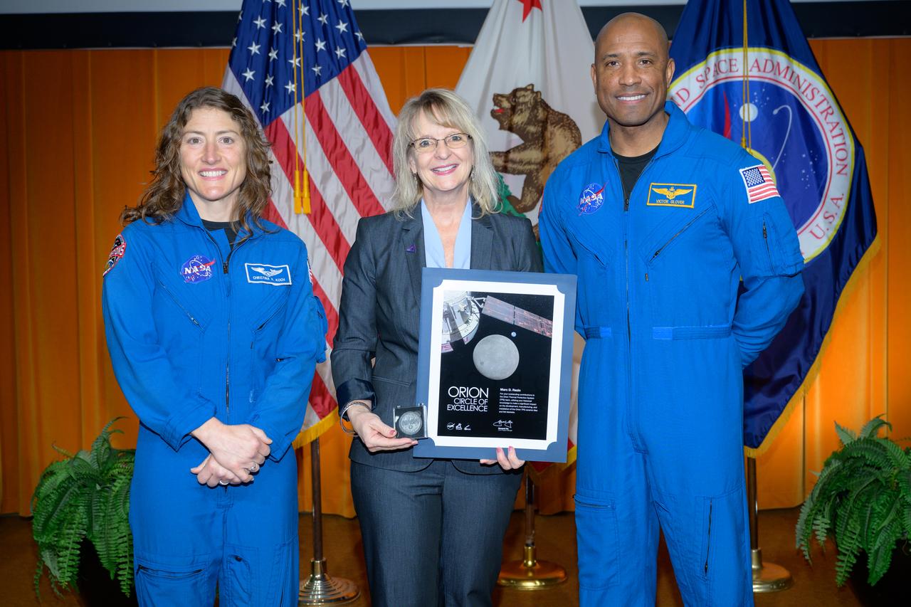 Artemis Orion Circle of Excellence Award presented to Marc D. Rezin received by Orion Deputy Program Manager Debbie Korth, left, NASA astronauts Victor J. Glover, right, and Christina Koch, left, in the N201 auditorium.