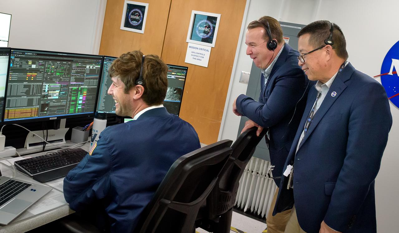 Volatiles Investigating Polar Exploration Rover (VIPER) vehicle operational readiness test in the Multi-Mission Operations Center (MMOC), N240A.  Jasper Wolfe, left, with David Korsmeyer, and Eugene Tu, right.