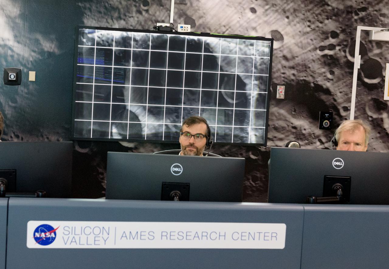 Zachary Burkland, left, and Jay Trimble, during the Volatiles Investigating Polar Exploration Rover (VIPER) vehicle operational readiness test in the Multi-Mission Operations Center (MMOC), N240A.