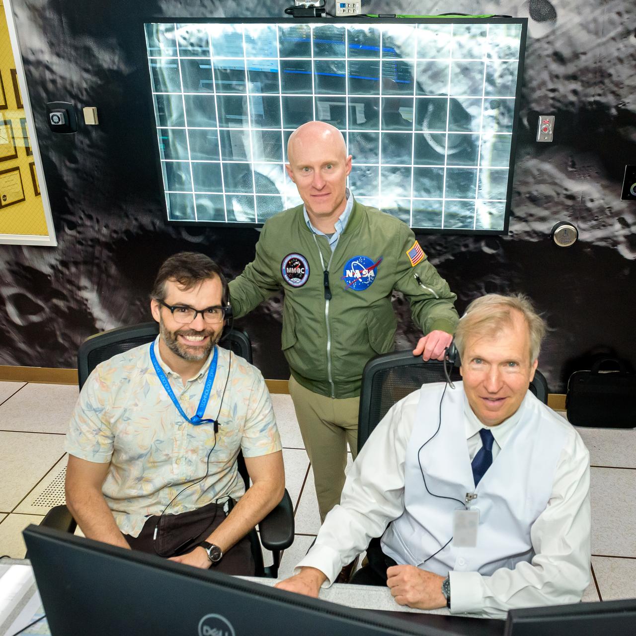 Zachary Burkland, left, Justin Pane, and Jay Trimble, right during the Volatiles Investigating Polar Exploration Rover (VIPER) vehicle operational readiness test in the Multi-Mission Operations Center (MMOC), N240A.